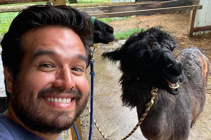 a close up of a man and a dog posing for the camera